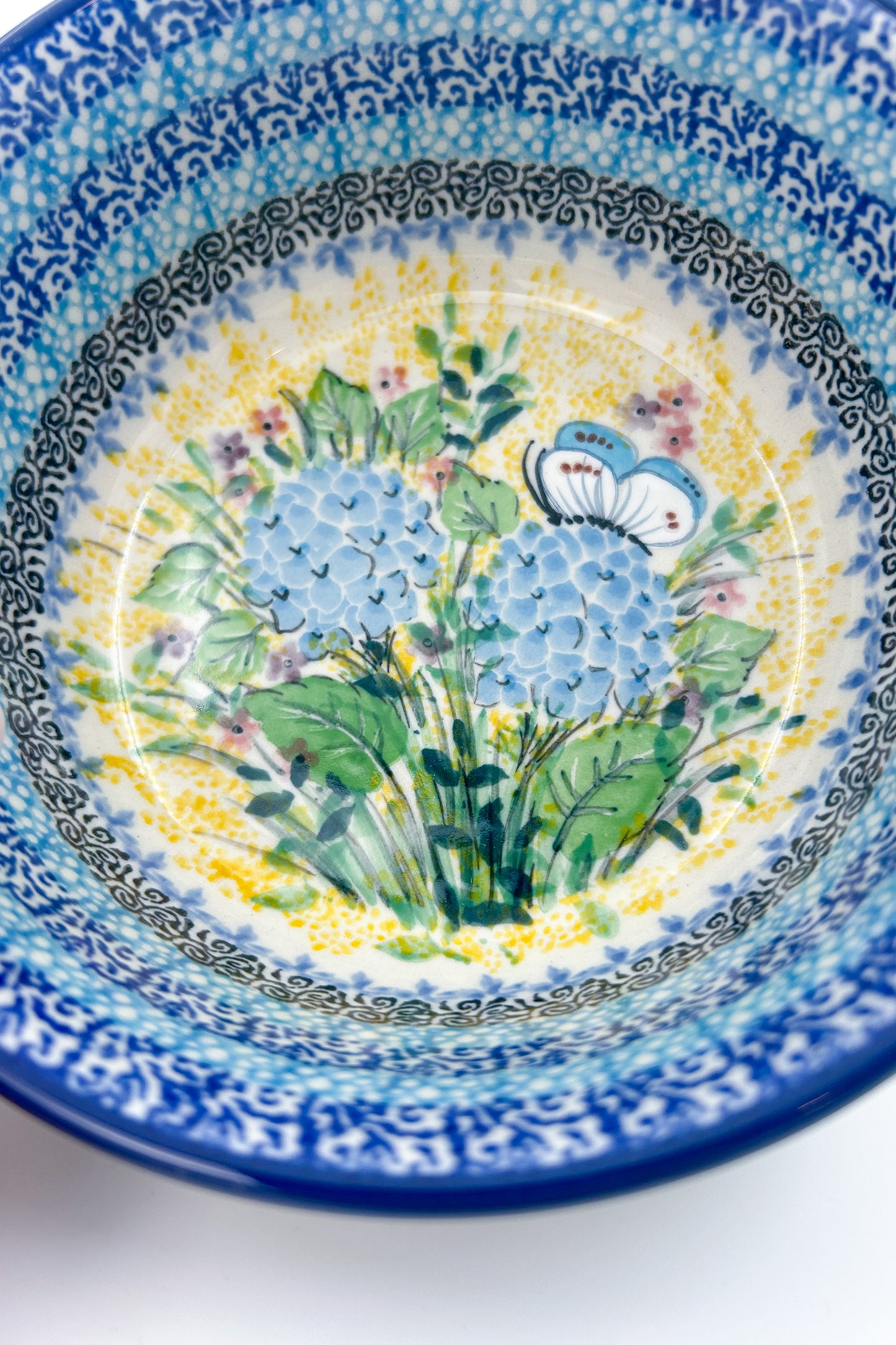 Polish pottery 6.57” blue floral stacking bowl in the UNIKAT Blue Hydrangea Pattern. It holds 24 ounces of fluid Dimension
Ceramika Artystyczna Company