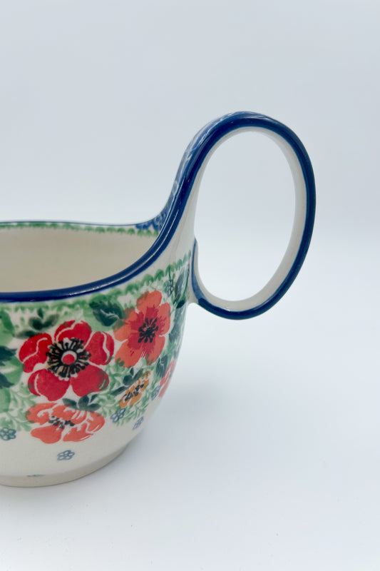Polish pottery 16oz bowl with loop handle in the UNIKAT Candy Red Poppy pattern. It holds 16 oz of fluid.
Ceramika Artystyczna Company