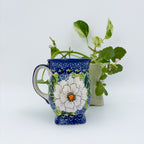 Wild Rose tulip mug, front view with plants in background