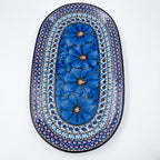 Cobalt Poppies oval platter, straight top-down view of full platter showing blue poppy column and dotted mosaic rings