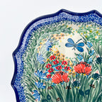 UNIKAT Dragonfly Bounty 8 point platter, close-up top-down view of blue dragonfly among red poppies and garden grasses