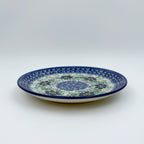 UNIKAT Blue Floral Day plate, front view showing blue flower ring and mosaic center on scalloped rim