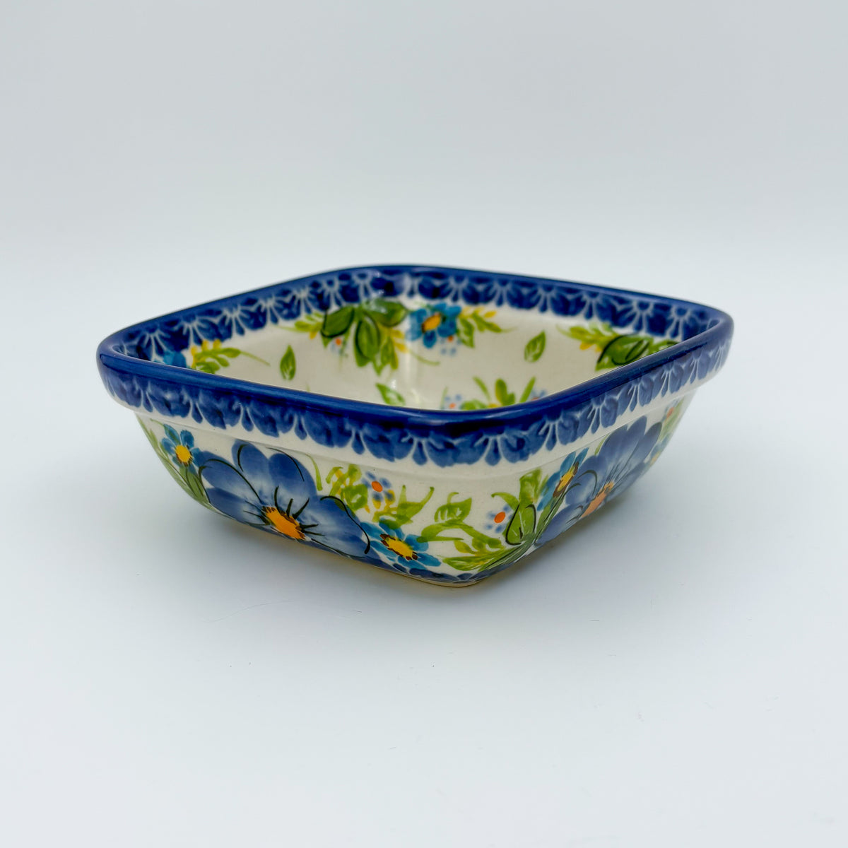 Blue Daisy square bowl on white background, front side view