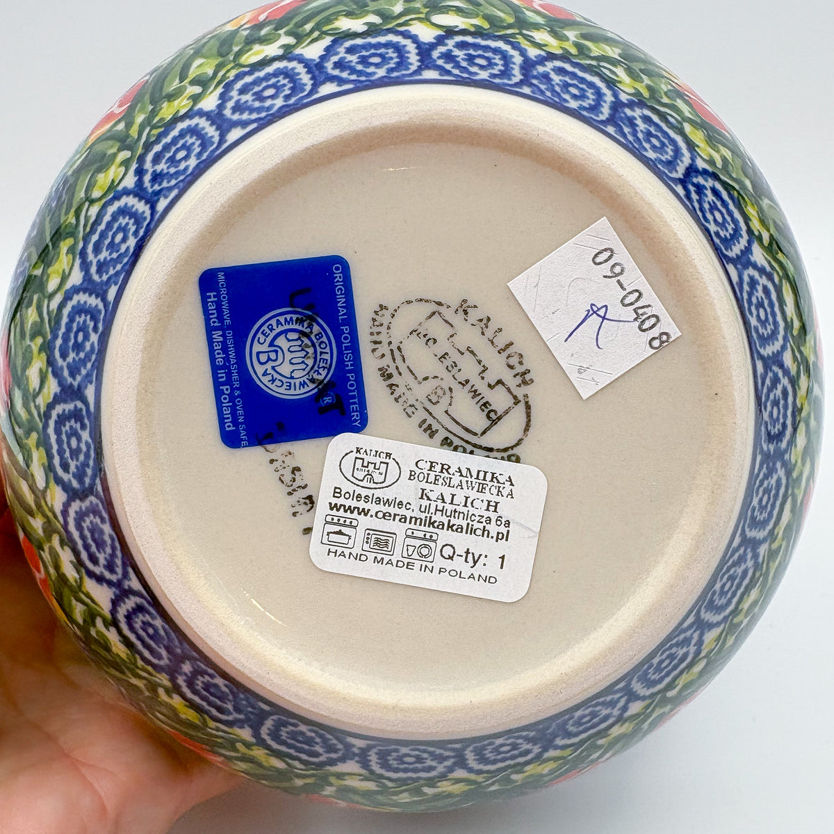 Bottom of Tulips and Bees bowl showing Kalich stamp, held in hand
