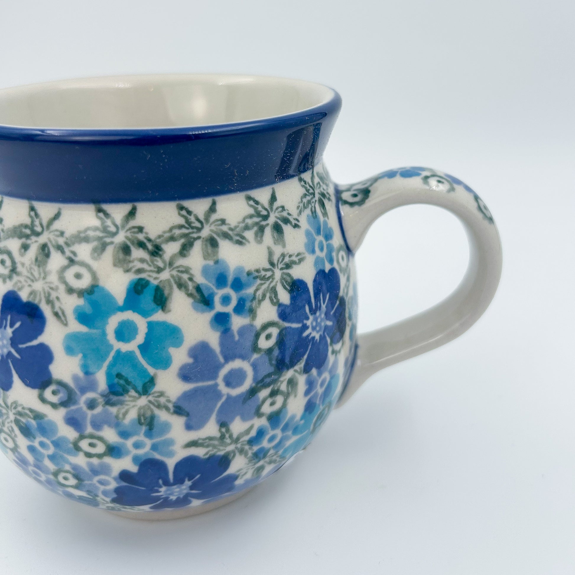 12 oz Polish Pottery UNIKAT bubble mug is made by talented artisans from Poland UNIKAT Fields of Blue Design. Ceramika Artystyczna Company