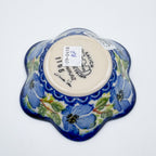 Bottom of Blue Poppy Songbird flower-shaped bowl showing Unikat stamp