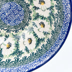 Close-up of daisy pattern and center medallion on Polish Daisies stacking bowl