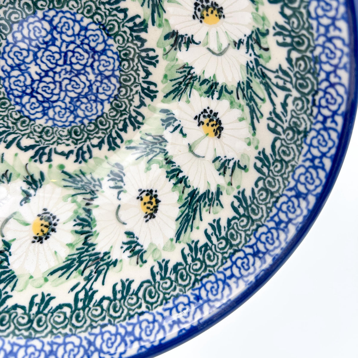 Close-up of daisy pattern and center medallion on Polish Daisies stacking bowl