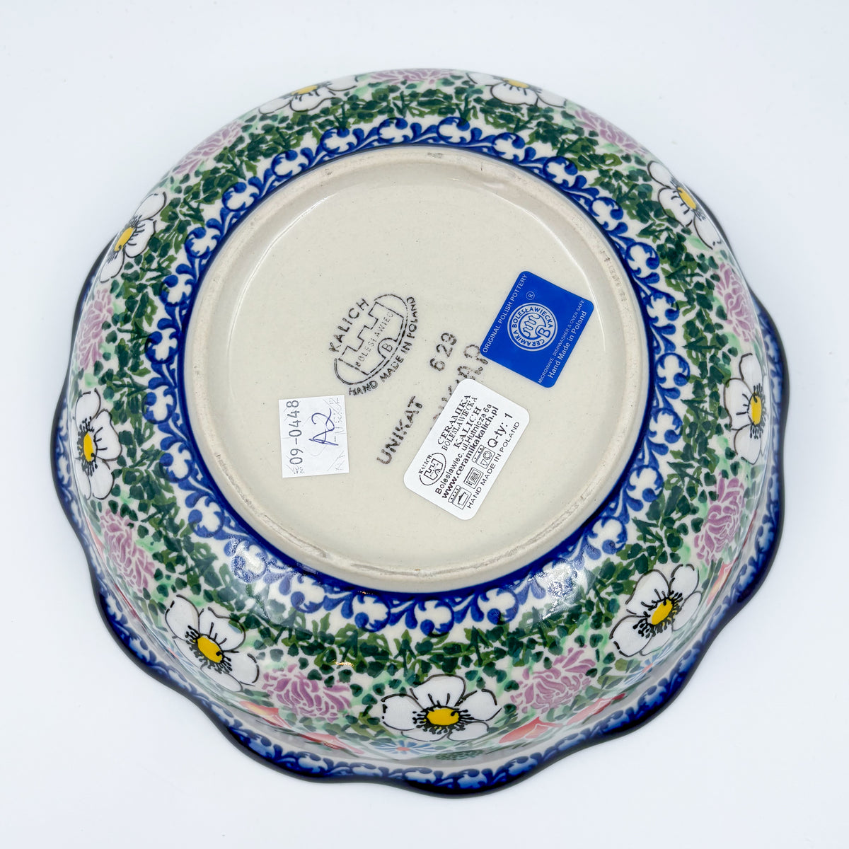 Bottom of Cottage Garden Kora bowl showing Unikat stamp and exterior floral border