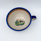 Top-down view into Hedgehog and Acorns latte mug showing painted hedgehog inside