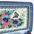 Mariposa rectangular platter, close-up rim detail showing layered floral border above butterfly and bouquet