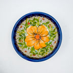 UNIKAT Orange Poppy small stacking bowl set, top-down view of medium bowl showing orange poppy and leaf pattern