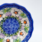 UNIKAT Primrose scalloped bowl, close-up of blue mandala center with poppy border detail