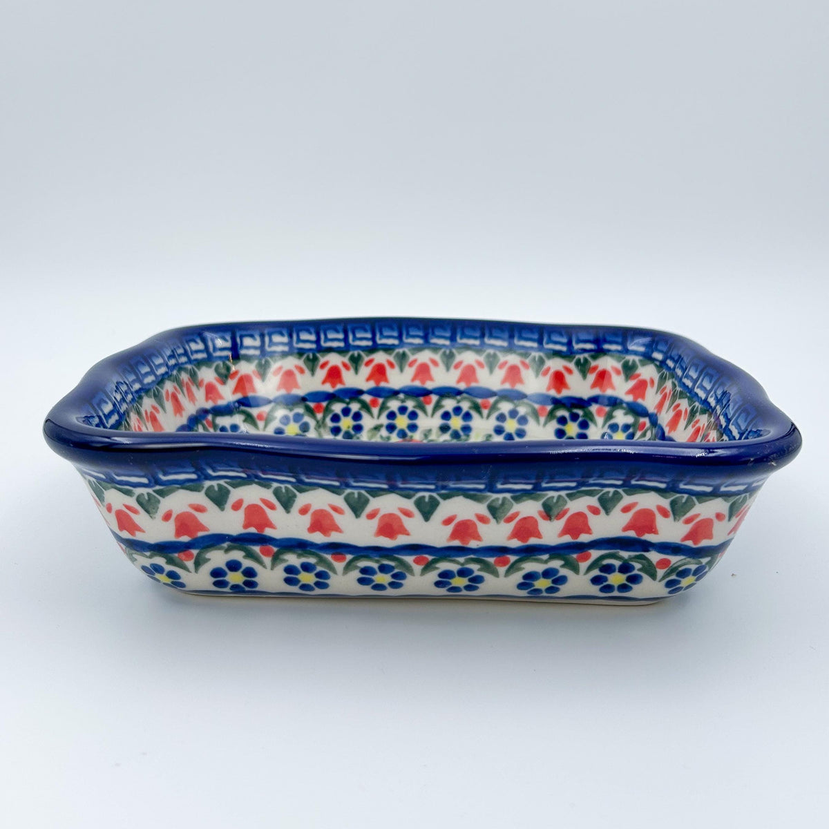 rectangular 8” baker with red poppy flowers is made by talented artisans