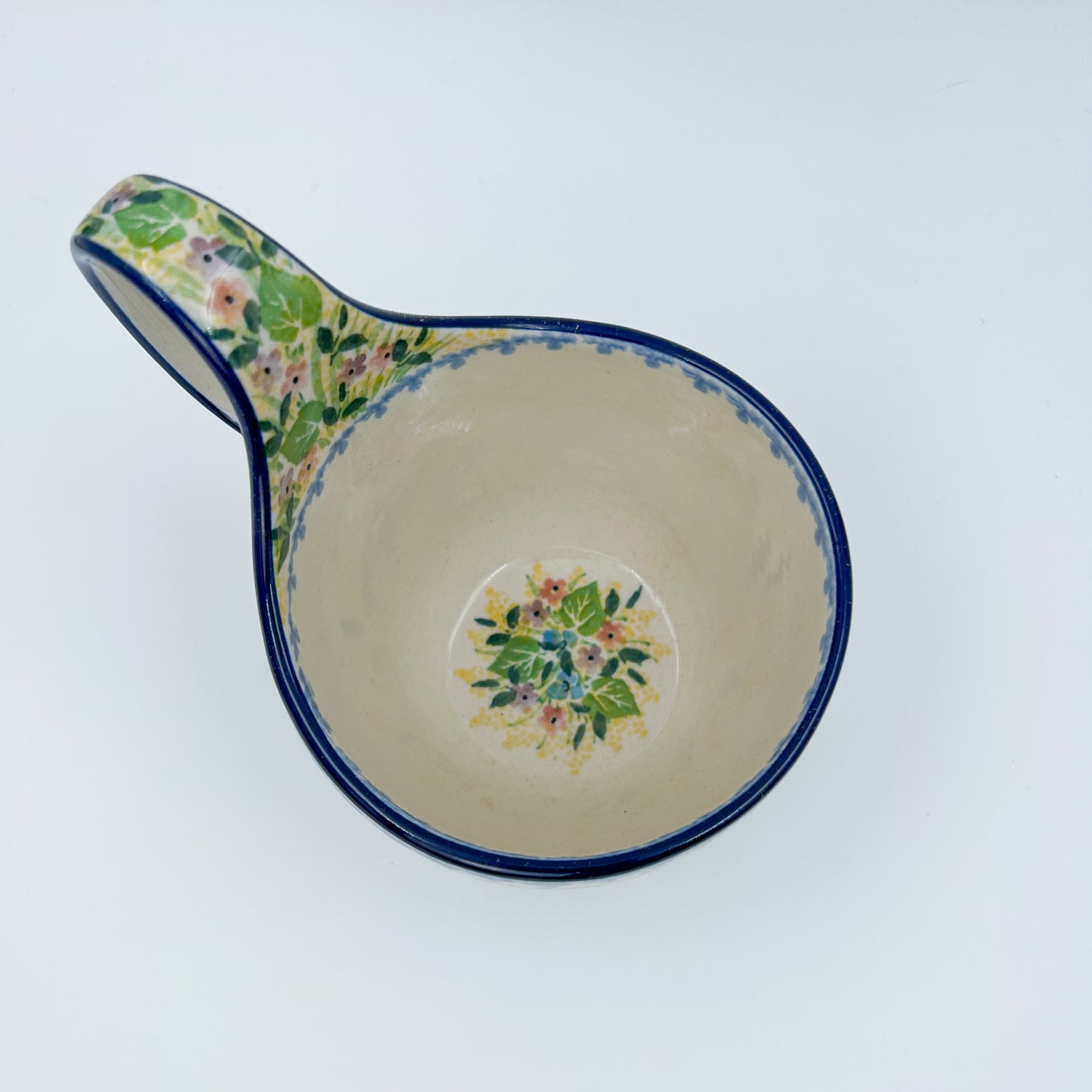 Polish pottery 16oz bowl with loop handle in the UNIKAT Blue Hydrangea pattern. This Polish Pottery bowl is made by talented artisans from Poland. 
6.26" x 4.49" x 5.51"
Ceramika Artystyczna Company