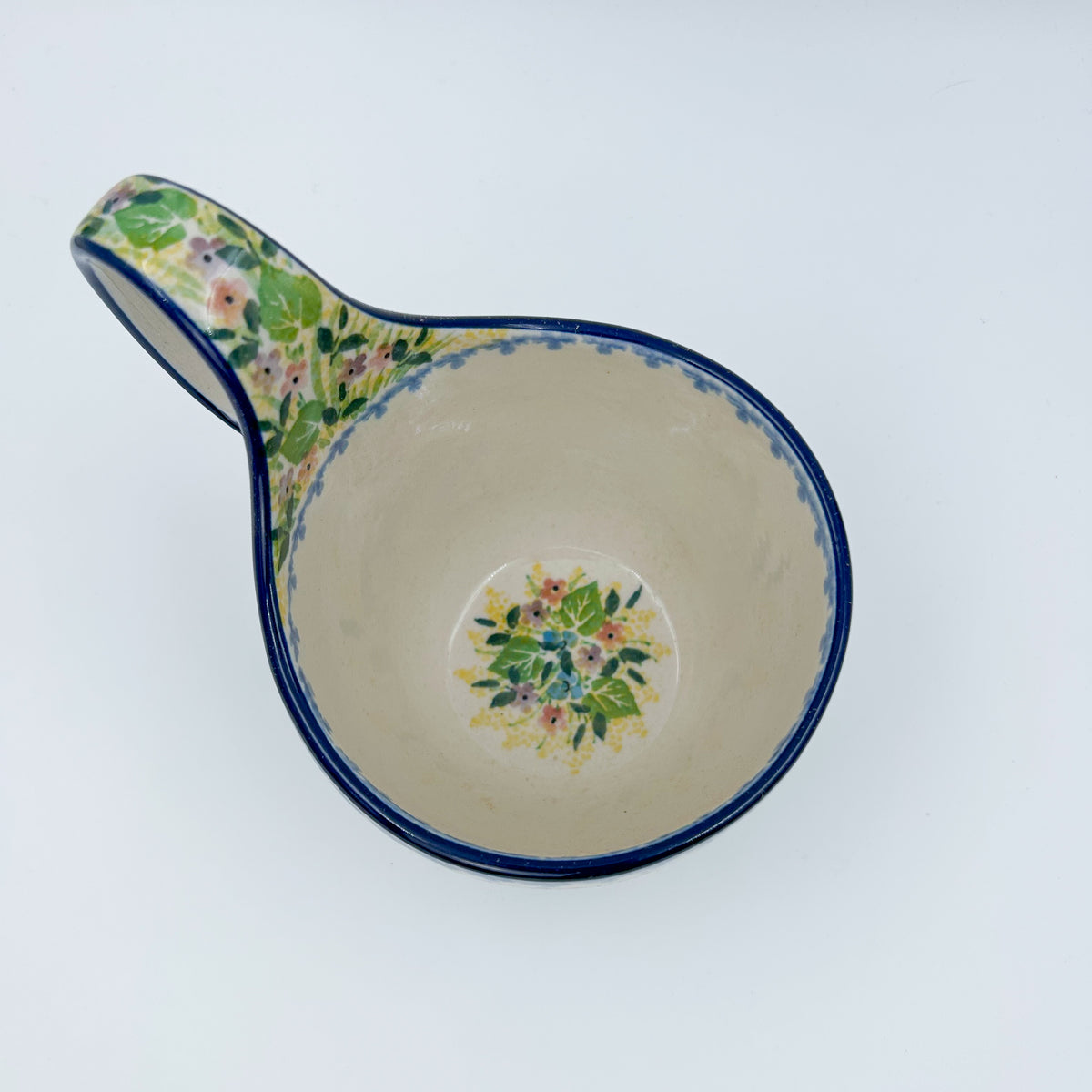 Polish pottery 16oz bowl with loop handle in the UNIKAT Blue Hydrangea pattern. This Polish Pottery bowl is made by talented artisans from Poland. 
6.26" x 4.49" x 5.51"
Ceramika Artystyczna Company