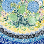 UNIKAT Blue Hydrangea pasta bowl, close-up top view of leaves and pink accent flowers