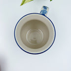 Top-down view into Blue Wildflower bubble mug showing cream interior