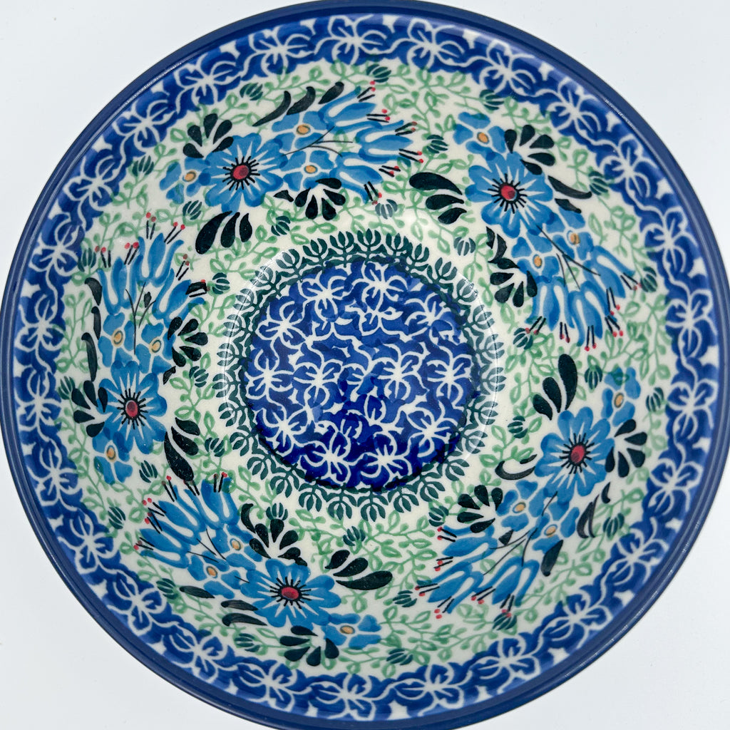 Windswept Blues bowl on white background, top-down straight-on view