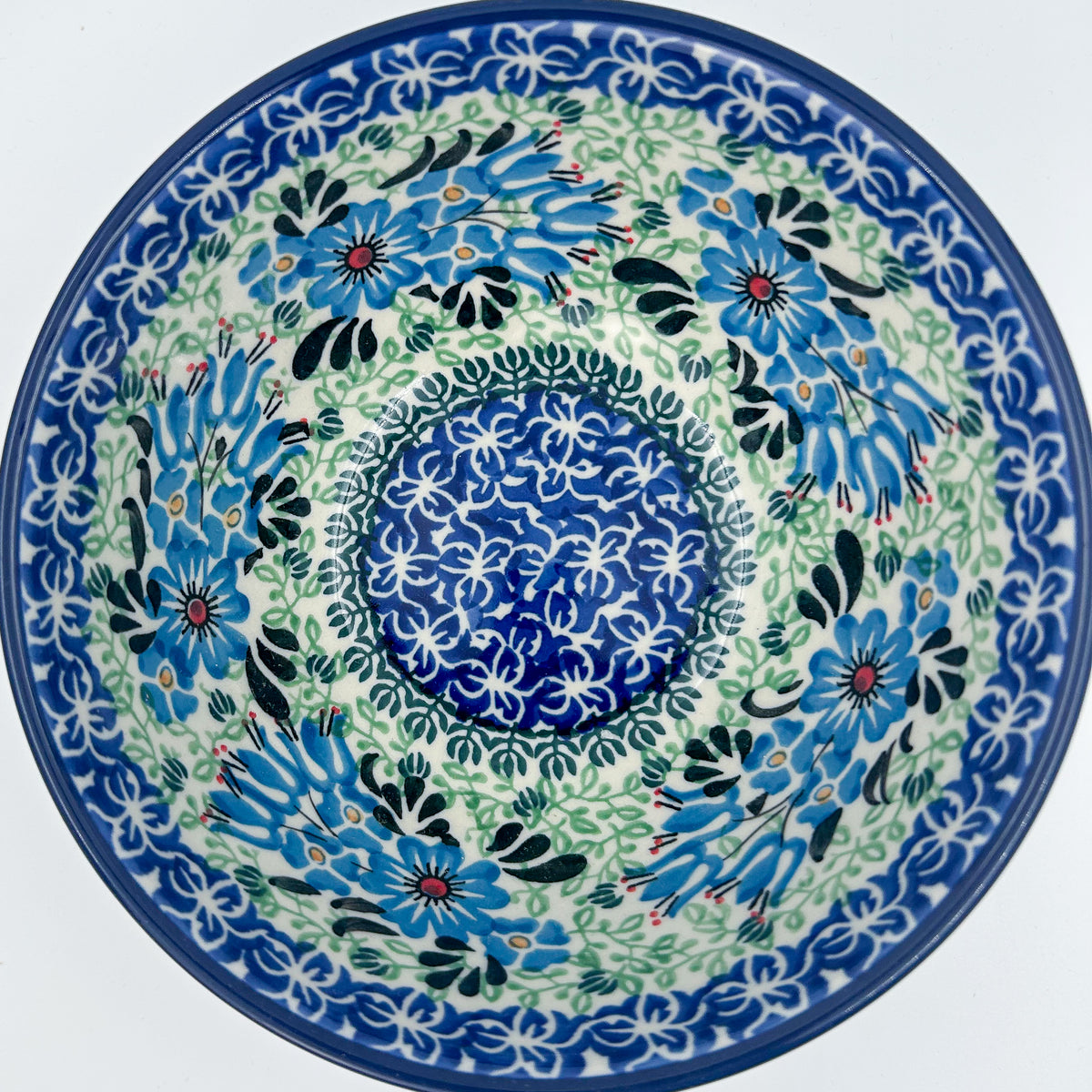Windswept Blues bowl on white background, top-down straight-on view