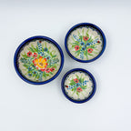 Ladybug Fields stacking bowl set, top-down view showing all three bowls