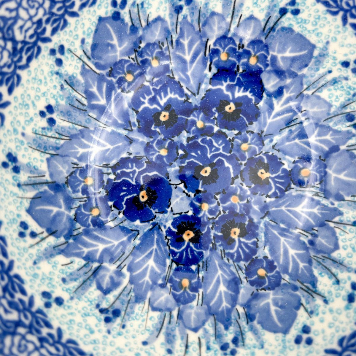 Close-up of pansy medallion center on Deep Winter stacking bowl