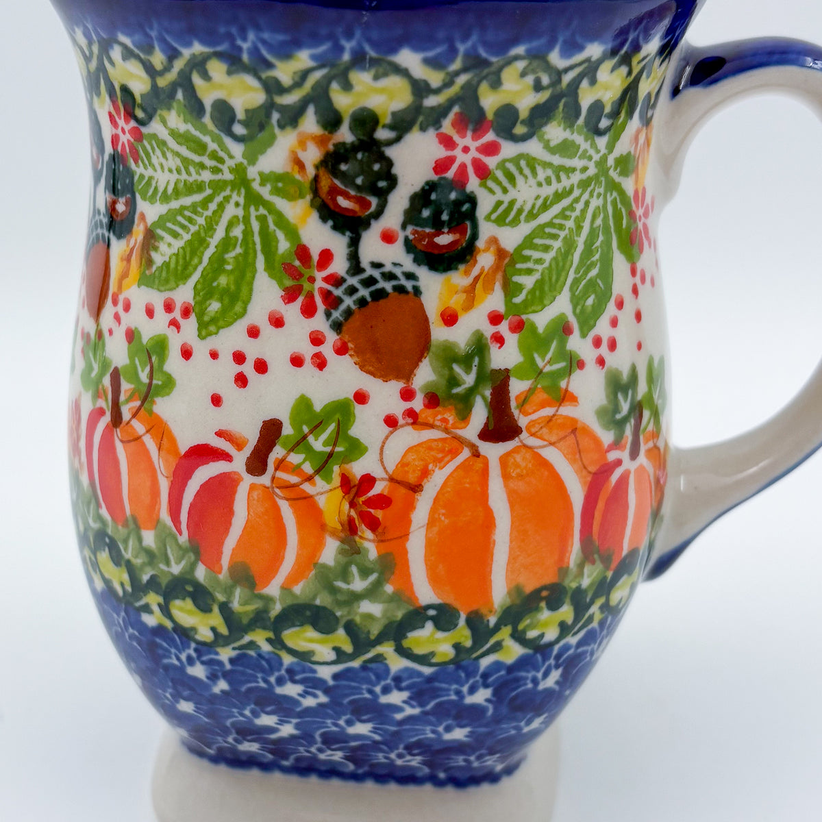 Close-up of acorns and pumpkins on Hedgehog and Pumpkins tulip mug