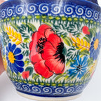 Close-up of red poppy pattern on Garden Poppy loop-handle bowl mug