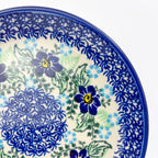 UNIKAT Blue Floral Day plate, close-up rim view showing dark blue flowers and green leaves