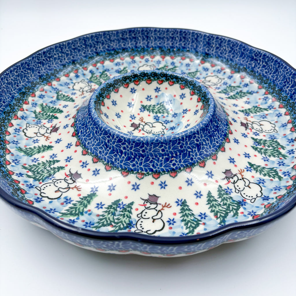 Dancing Snowman chip and dip platter, angled front view showing scalloped rim, center dip bowl, and snowmen with pine trees