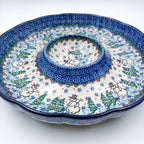 Dancing Snowman chip and dip platter, angled front view showing scalloped rim, center dip bowl, and snowmen with pine trees