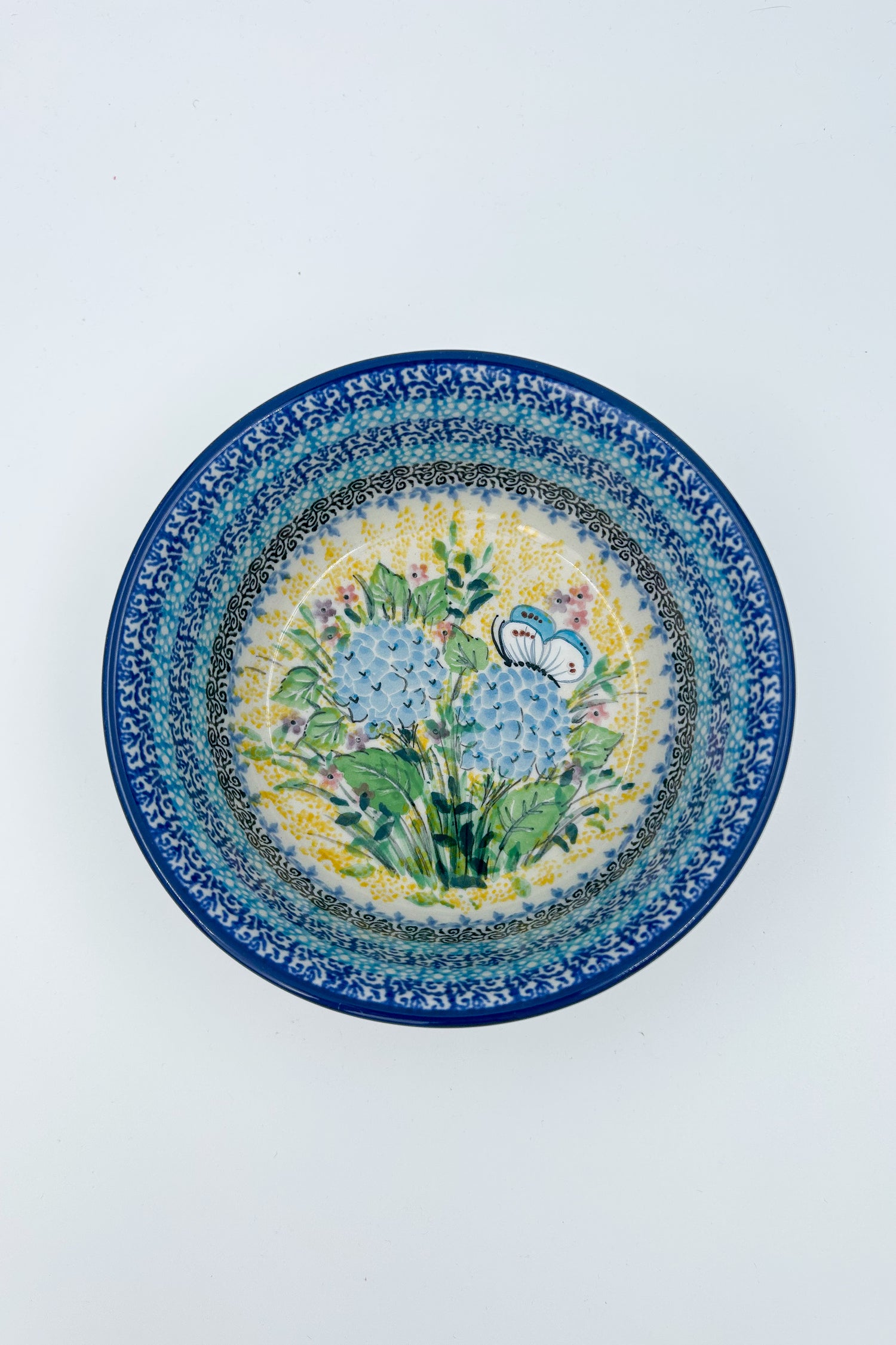 Polish pottery 6.57” blue floral stacking bowl in the UNIKAT &nbsp;Blue Hydrangea Pattern.  It holds 24 ounces of fluid Dimension
Ceramika Artystyczna Company
