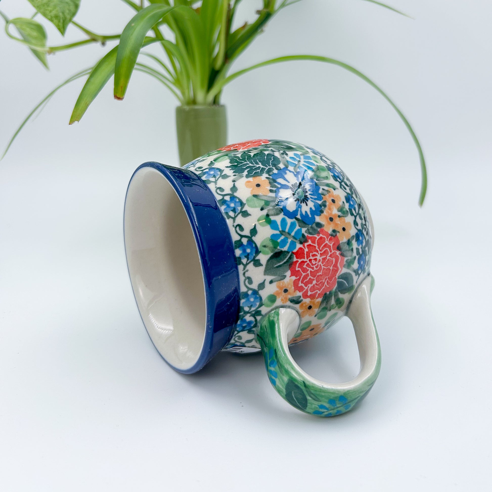 12 oz Polish Pottery floral UNIKAT bubble mug is made by talented artisans from Poland. 
Dimensions 5" x 3.66" x 3.78"
Ceramika Artystyczna Company