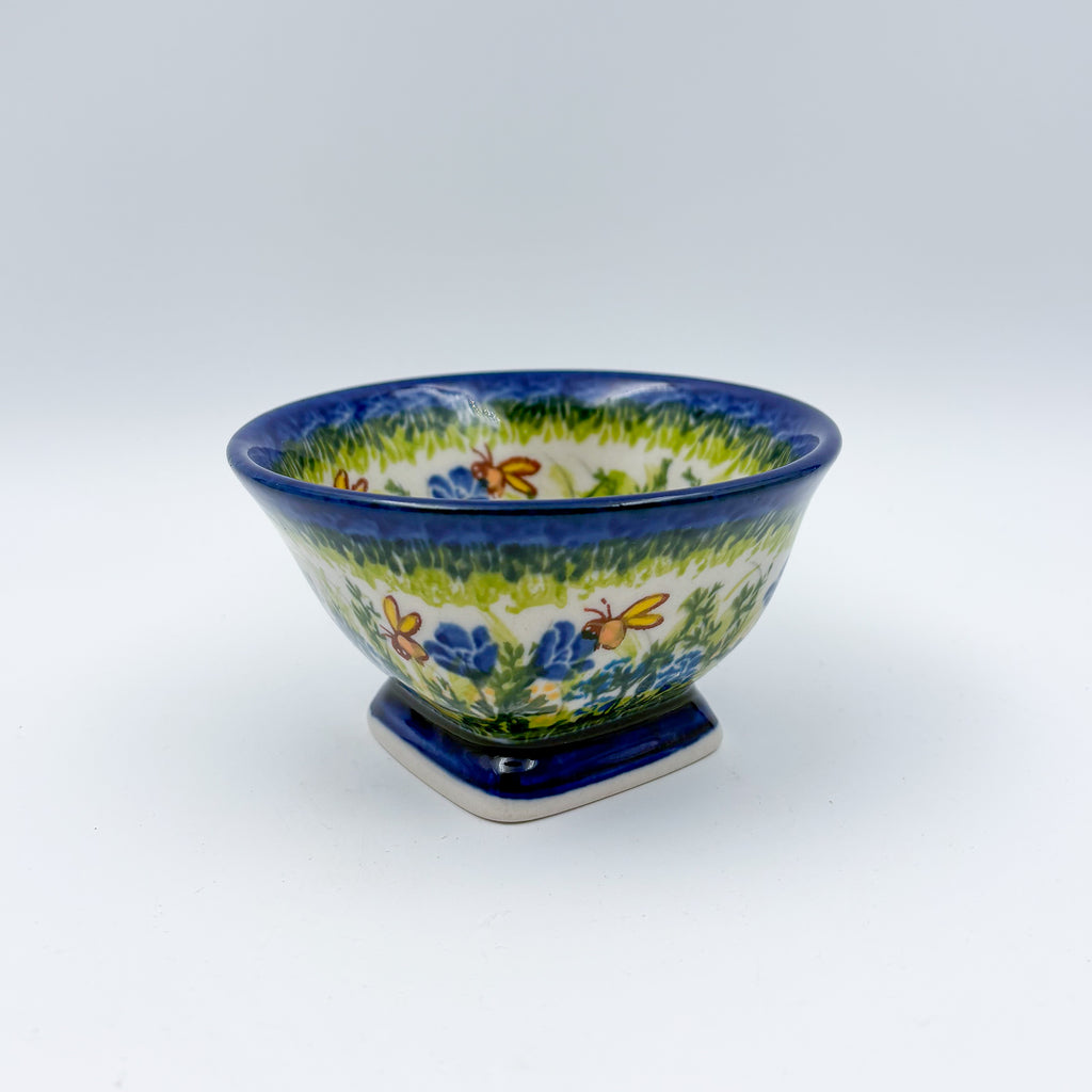 Bluebell Meadow small pedestal bowl, angled front view showing bluebell florals and butterfly pattern