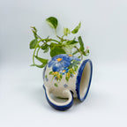 Blue Pansy bubble mug tipped on its side showing interior rim and handle