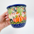 Hedgehog and Pumpkins Viking mug held in hand, front view