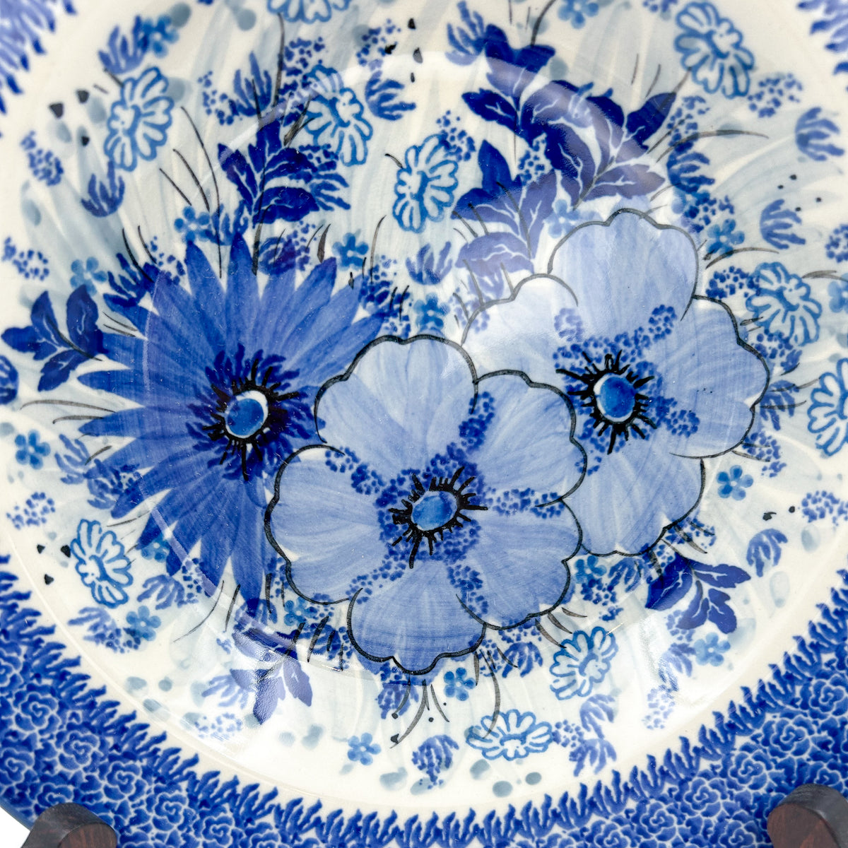 UNIKAT Blue Wildflower Patch pasta bowl, top-down close-up of layered blue wildflower cluster