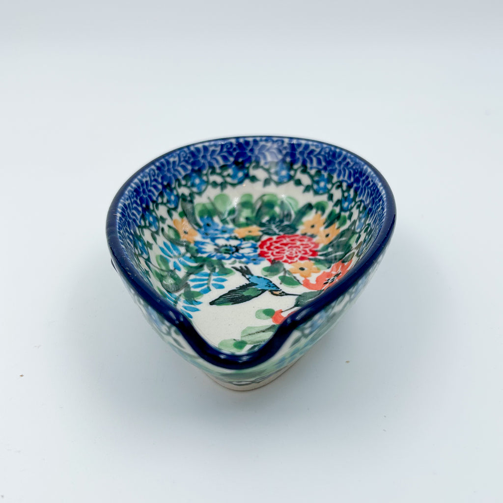 This 5” floral spoon rest is a handmade by talented Polish artisans. This is a Polish UNIKAT Hummingbird Meadow pattern.
Dimensions 4.92” x 3.35 x 1.34"