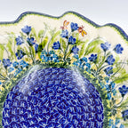 Close-up of scalloped rim showing dragonfly and bee on Bluebell Meadow wave bowl