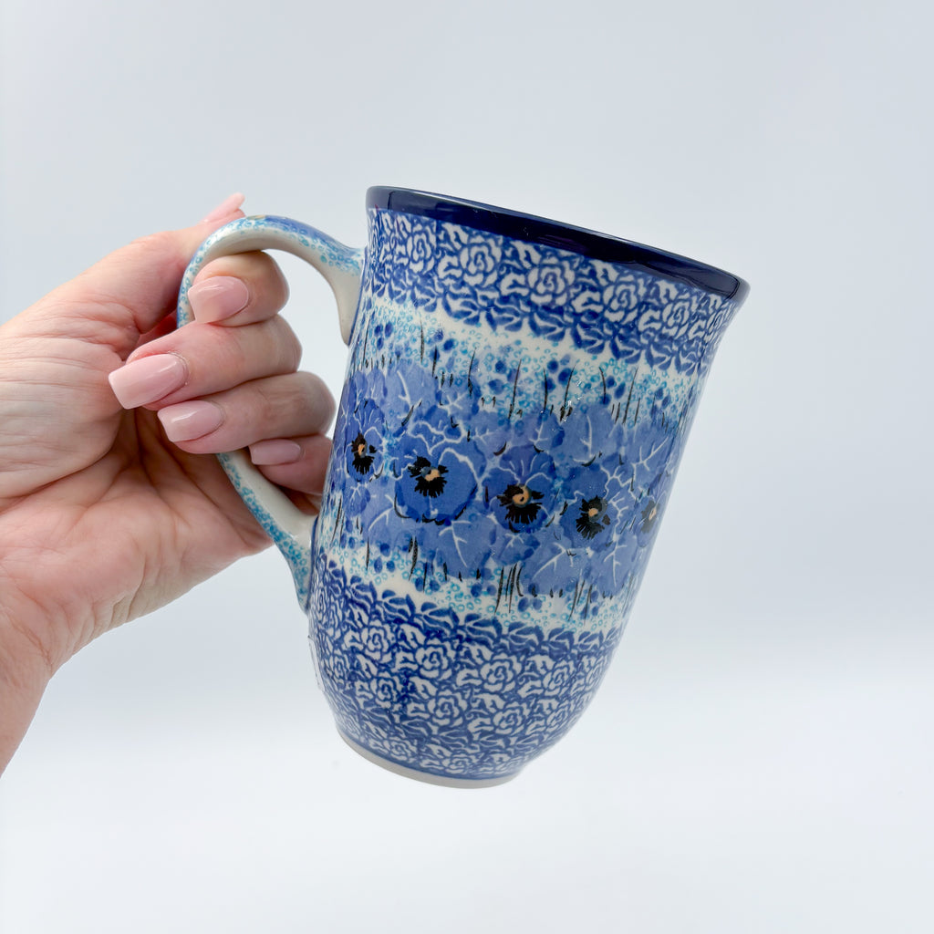Deep Winter latte mug held in hand, front view