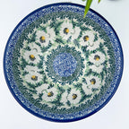 Polish Daisies stacking bowl, top-down view showing full daisy pattern and blue center