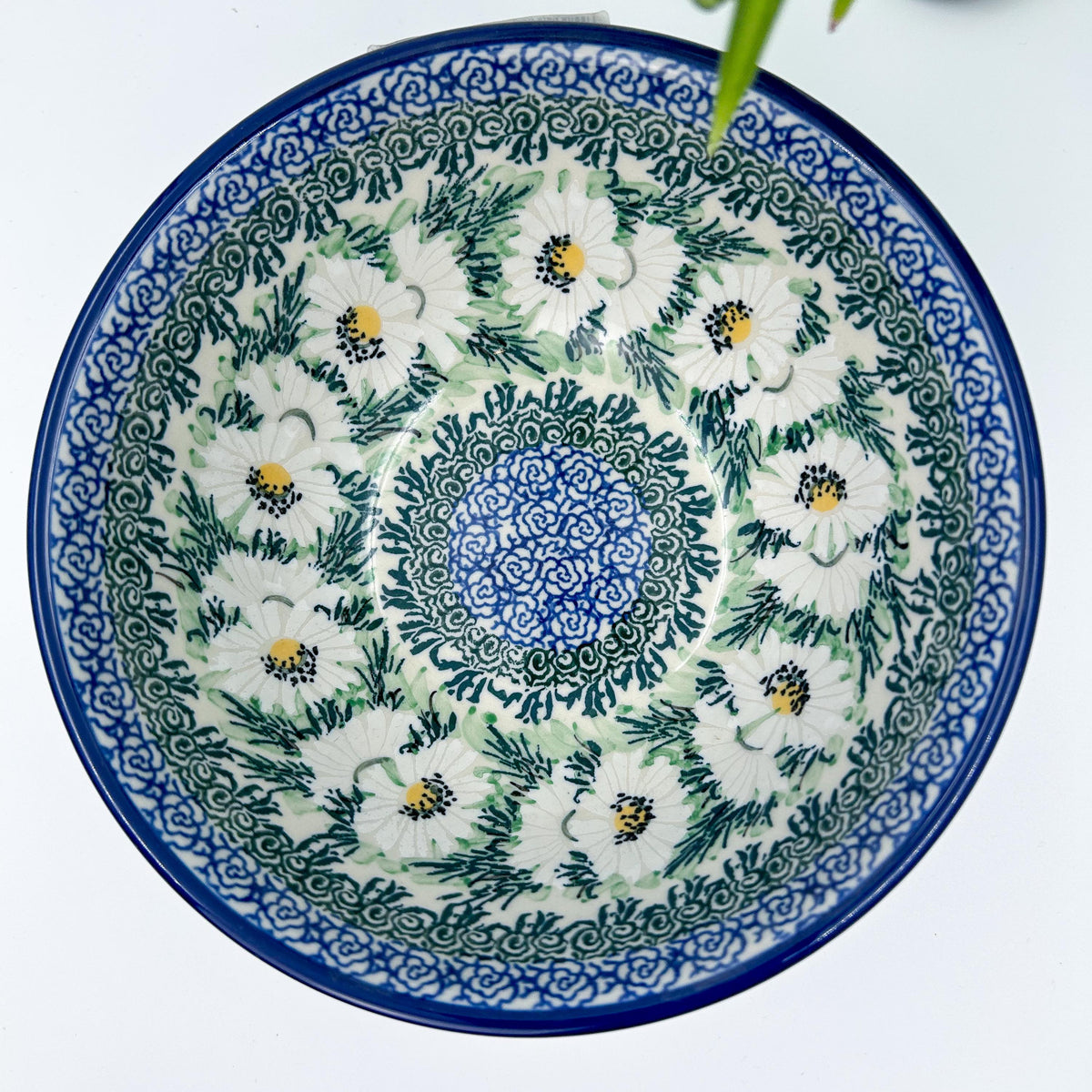 Polish Daisies stacking bowl, top-down view showing full daisy pattern and blue center