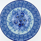 Deep Winter stacking bowl, top-down view showing pansy medallion center