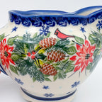 UNIKAT Cardinal Winter gravy dish, close-up of cardinal, pinecones, and poinsettias with snowflake accents