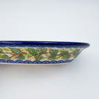 UNIKAT Blue Poppy Songbird oval Milano platter, close-up end view of leaf border pattern