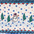 UNIKAT Snowman Stroll rectangular platter, close-up of single snowman with top hat and stick arms between pine trees