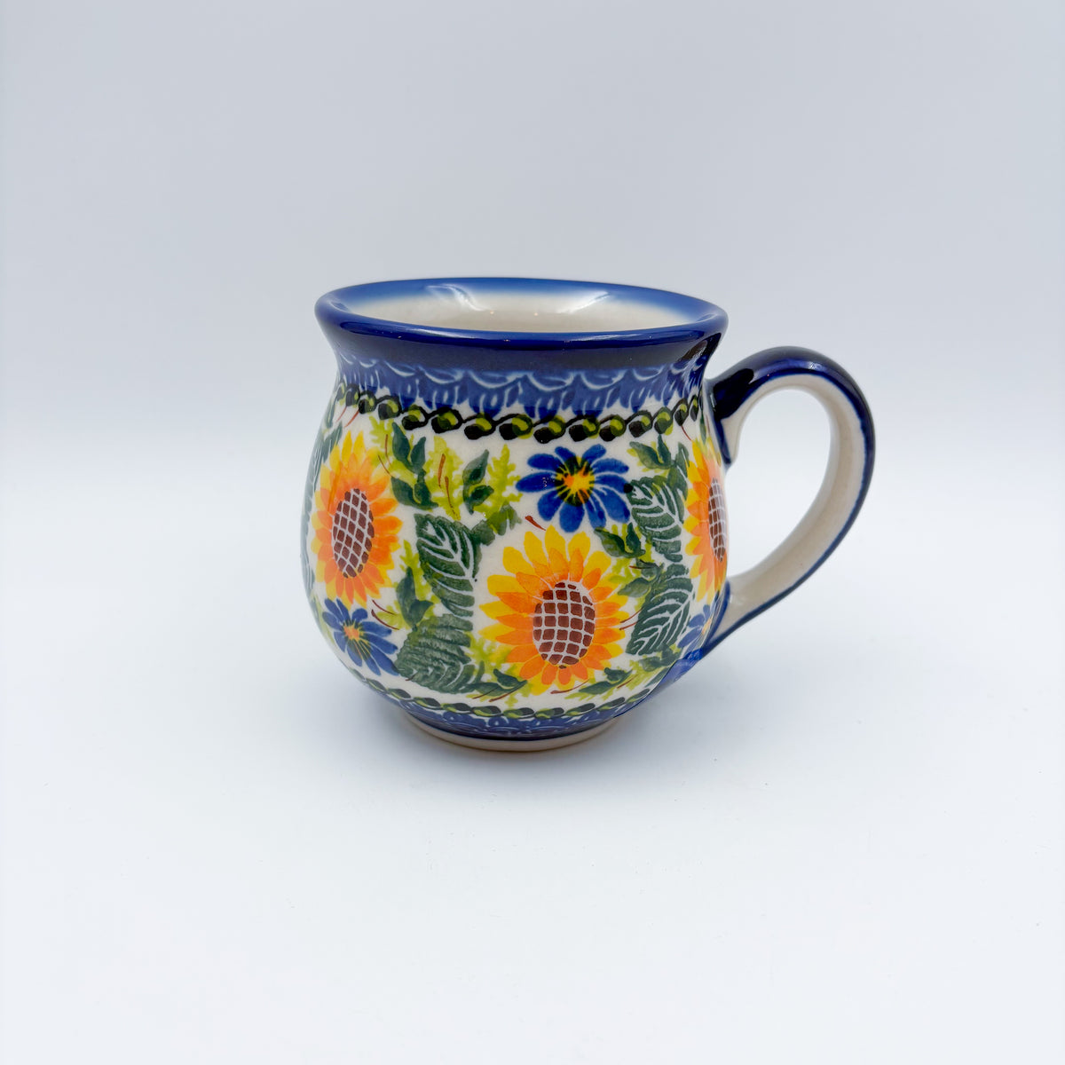 Fall Sunflower bubble mug on white background, angled view with handle