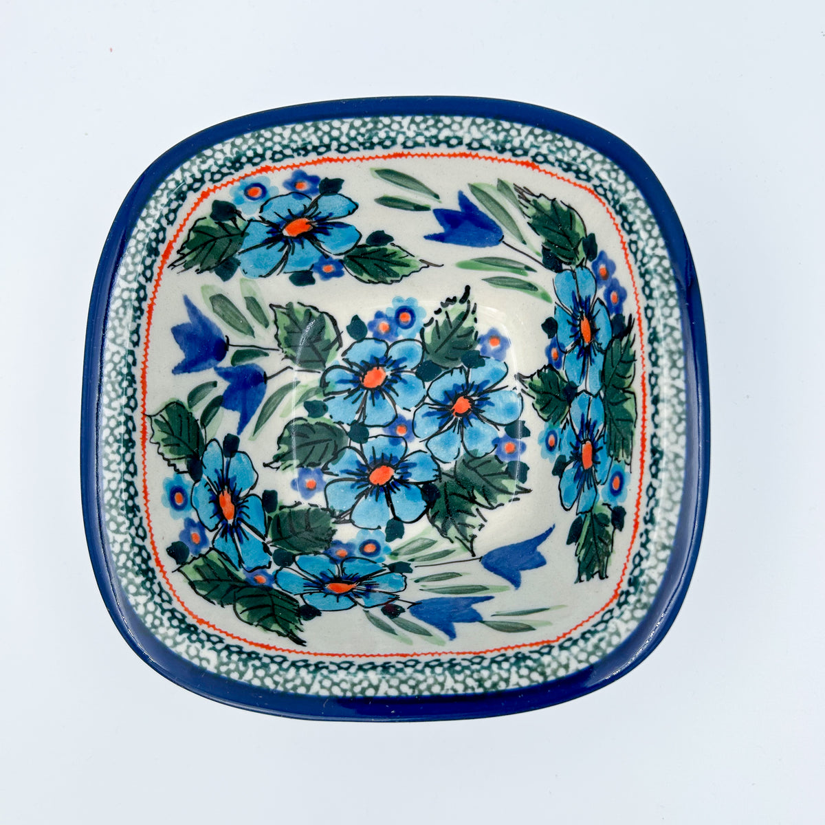 Evangeline square bowl on white background, top-down straight-on view