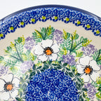 UNIKAT Primrose plate, close-up rim view showing white poppy and lavender floral border