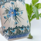 Close-up angled view of Forget Me Not floral medallion pattern